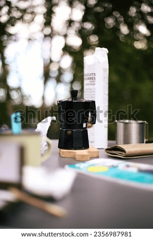 Italian Coffee Maker on Camping Table in Nature