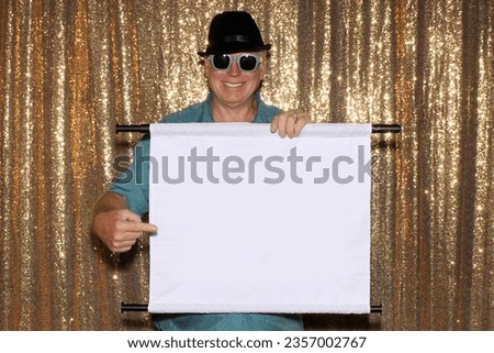 Photo Booth. A man smiles as he holds a Blank White Sign with room for your Text or Images. Photo Booth Picture. People love Photo Booths at Parties and Events. Blank white sign with room for Text. 