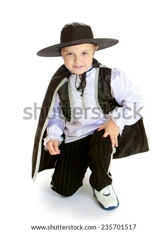Theatrical productions, children's fashion, child development concept.little boy in the big wide-brimmed hat and theatrical costumes.