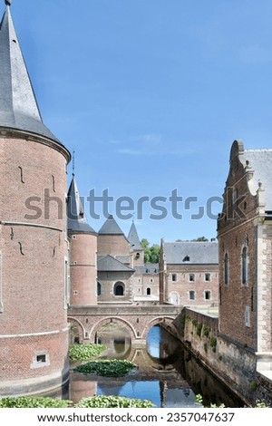 Beautiful  16th century Alden Biesen castle and moat in Limburg, Belgium. Royalty-Free Stock Photo #2357047637