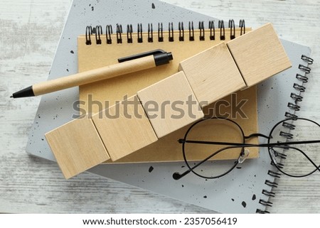 Wooden cubes with empty copy space for message word on wooden background. 5 wooden cubes