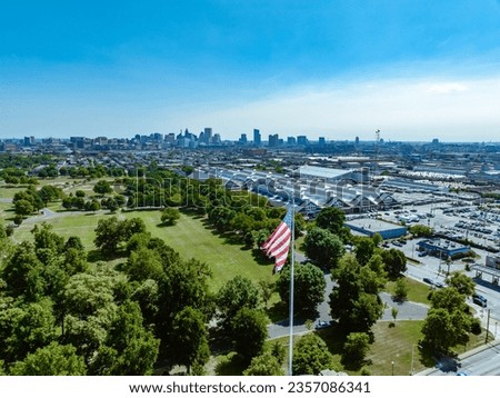 View of Baltimore Maryland Skyline with American flag in foreground
