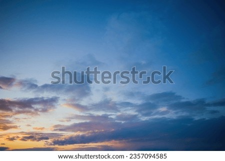 blue sky with clouds and the setting sun. copy space.
