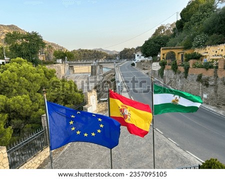 Flags on display outside a hotel at Posada del Conde, Guadalhorce, Spain. July 22nd 2023 Royalty-Free Stock Photo #2357095105