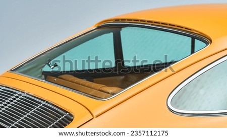 Rear decklid and rear window on a orange car