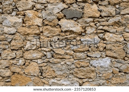 Texture or background of a stone fence. Background with selective focus and copy space