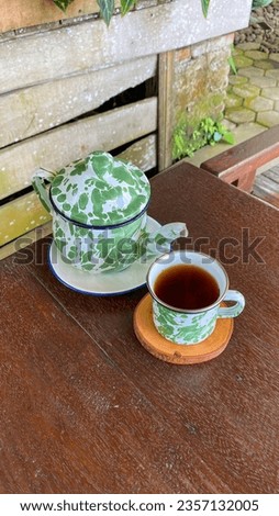 The picture of a cup of tea in Purwokerto, Central Java, Indonesia. This photo was taken on September 5, 2023 by a professional. This photo contains a nice tea in tropical country
