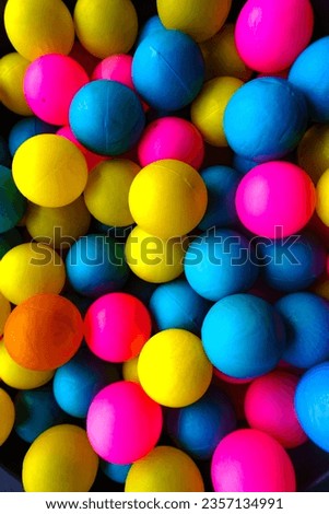 Colorful toy plastic balls with striking colors.