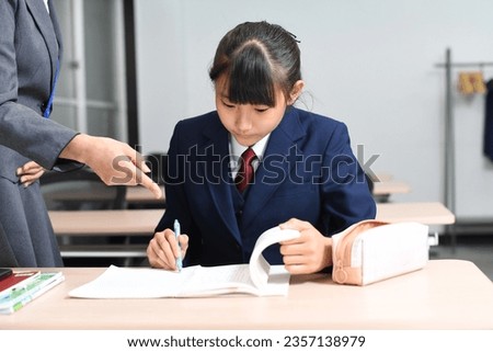 Image of students and teachers taking classes at a cram school
 Royalty-Free Stock Photo #2357138979