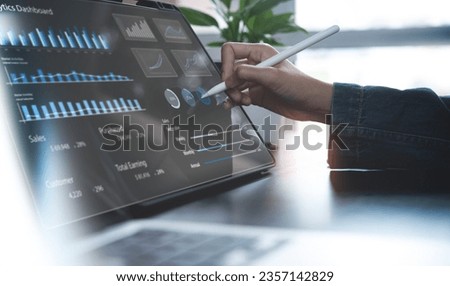 Businessman using digital tablet analyzing sales data and financial growth graph chart report. Business planning, strategy and development. Financial and banking. market research, data analysis