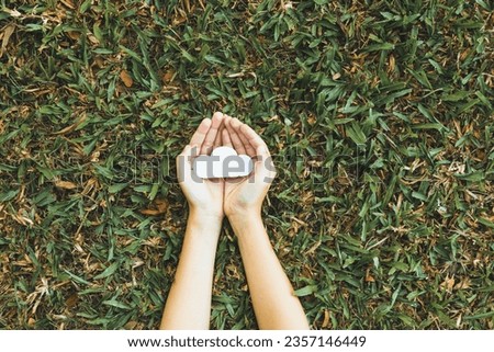 Top view hand holding CO2 gases icon symbolize eco-friendly business corporation committed to environmental friendly transport and zero carbon emission. Corporate responsible for greener society. Gyre