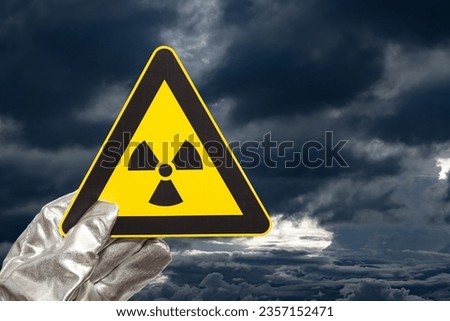 nuclear radiation warning sign with dark and heavy clouds Royalty-Free Stock Photo #2357152471