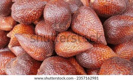 Close-up view of salak fruit on display in supermarket. Salak fruit has sharp skin.
