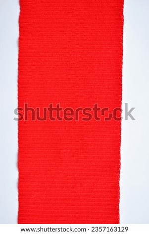 red wool knitted yarn texture, woolen fabric on white background