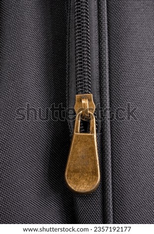 Detail of a zipper on a guitar bag, close up shot