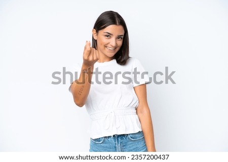 Young caucasian woman isolated on white background making money gesture