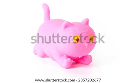 Colorful rubber toy cat isolated on white background. High quality photo
