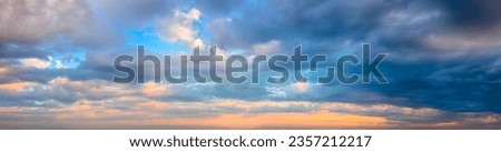 Stormy Dramatic Sky - Vibrant colors Pof Real Sky - Panoramic Sunrise Sundown Sanset Sky with colorful clouds. Without any birds.  Natural Cloudscape background.