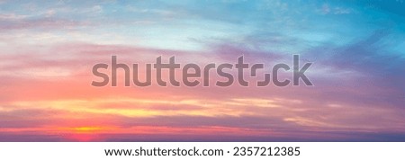 Gentle ligth colors of sunrise sundown sky with colorful light  clouds, hi resolutions cloudscape panorama Royalty-Free Stock Photo #2357212385