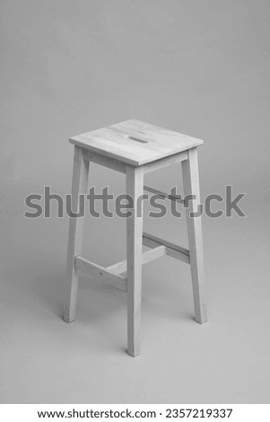 Beige wooden bar stool on black and white background,Isolated wooden chair ,Wooden Bar Stools for kitchen or retaurant,isolated on grey background,wood texture.Modern wooden chairs isolated 