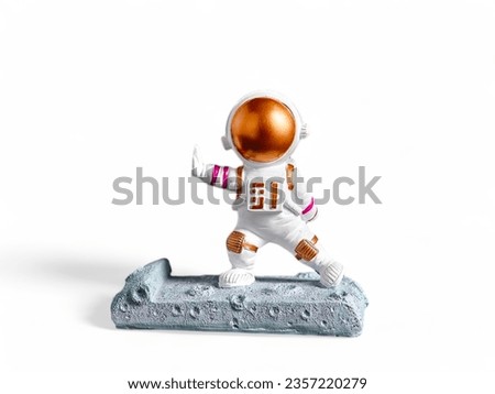 astronaut with miniature figure pose isolated on white