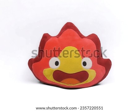 Fire shaped doll isolated on white