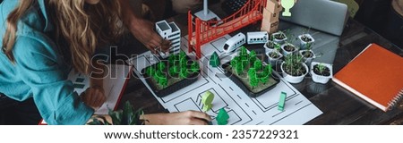 International diverse group of students working on modern urban architecture project with renewable energy source, alternative electricity, waste recycling. Brainstorming ideas, business plan. Banner Royalty-Free Stock Photo #2357229321