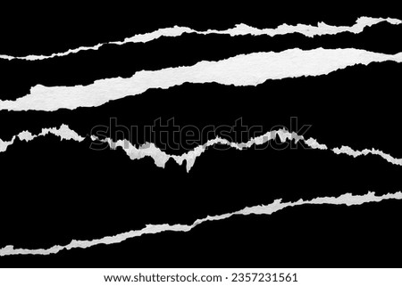 Ripped torn paper edges set isolated on black background Royalty-Free Stock Photo #2357231561