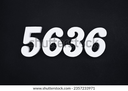 Black for the background. The number 5636 is made of white painted wood.