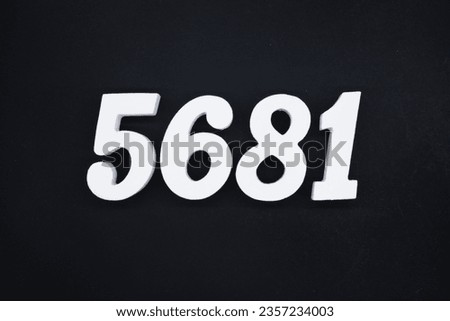 Black for the background. The number 5681 is made of white painted wood.