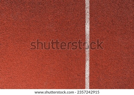 Running track surface with lanes and lines on a track and field athletics stadium. Sport running, jogging or walking runway. Royalty-Free Stock Photo #2357242915