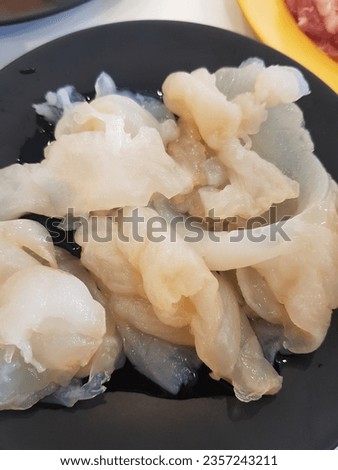 white delicious jelly fish in moo kra ta menu in Thailand Royalty-Free Stock Photo #2357243211
