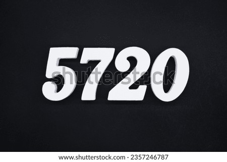 Black for the background. The number 5720 is made of white painted wood.