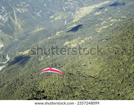 Paragliding flying above Julian Alps in Slovenia,Europe, Tolmin area with take off site from Kobala mountain