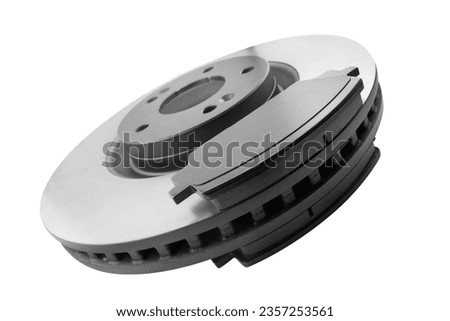 Brake discs and brake pads isolated on white background. Auto parts. Brake disc rotor isolated on white. Braking disk. Car part. Quality spare parts for car service or maintenance Royalty-Free Stock Photo #2357253561