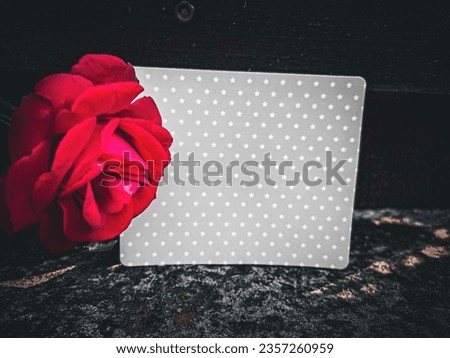 A rose and a card