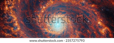 Large spiral galaxy in space. Blue light emanates from stars and dust at core’s center. Beautiful galaxy in universe. Space telescope images. Elements of this image furnished by NASA Royalty-Free Stock Photo #2357275793