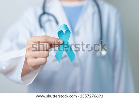 Blue November Prostate Cancer Awareness month, Doctor with Blue Ribbon in hospital for support people life and illness. Healthcare, International men, Father, Diabetes and World cancer day Royalty-Free Stock Photo #2357276693