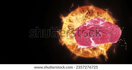 Web banner - fresh steak meat falling on the fire grill-photo levitation concept-creative idea-black background