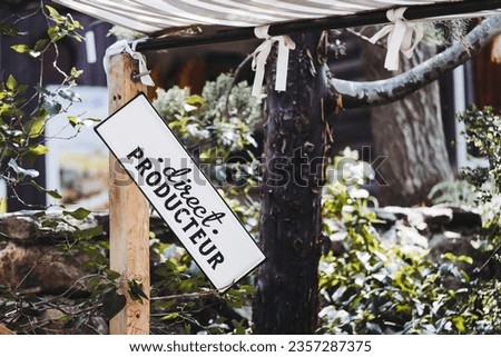 Vintage sign with inscription in French "direct producer" on an artisanal organic market