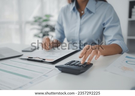 Person working with documents on desk, accountant checking company budget accounting documents, auditing financial statements, preparing company balance sheet financial statements. Audit concept. Royalty-Free Stock Photo #2357292225
