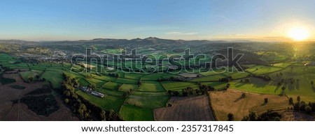 Panoramic view of a sunset over the Brecon Beacons looking towards the highest peaks of Penyfan and Corn Du in South Wales UK
 Royalty-Free Stock Photo #2357317845
