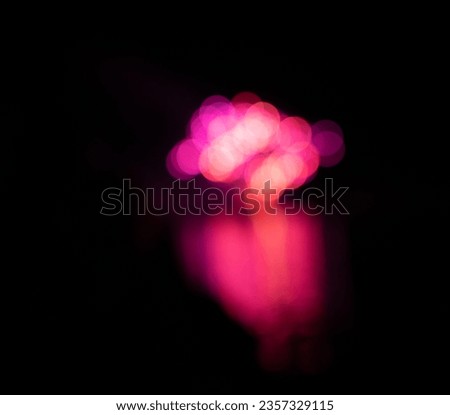abstract soft focus bokeh light reflected on water pink color floating in black sky in background vibrant pink color on solid black room for type colorful celebratory backdrop background wallpaper 