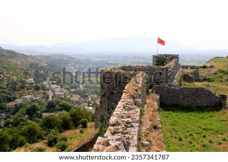 Albania national flag waving on the tower of the old Shkodra fortress, Rozafa Castle