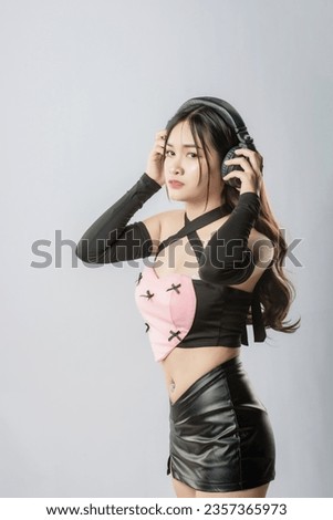 Happy young singer recording music sound through microphone in studio isolated on white background