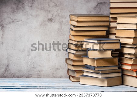 Open book, hardback books on wooden table. Back to school. Copy space	