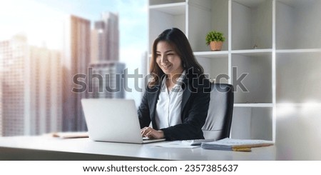 Asian businesswoman working with laptop in office. business financial concept