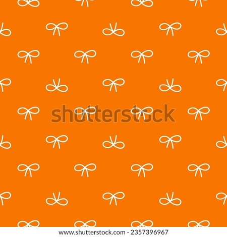 Orange seamless pattern with white bows