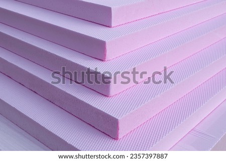 Pink Foam Board Product Extruded Polystyrene Insulation Foam XPS with drainage channels on the surface. Building material  waterproof and ground  thermal insulation coatings Royalty-Free Stock Photo #2357397887