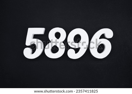 Black for the background. The number 5896 is made of white painted wood.